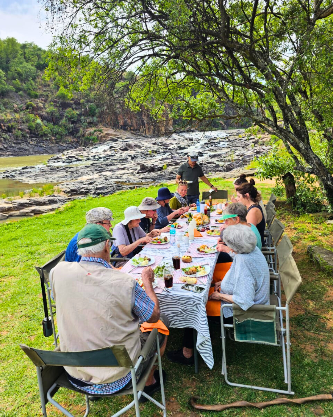Guests enjoying lunch along the Sundays river, Nambiti Private Game Reserve, KZN